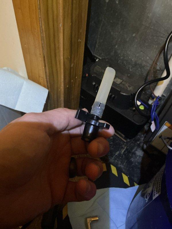 Responded to cooling system refrigerant leak concern at residential property. Upon inspection, identified leaking Schrader valve core on refrigerant line near furnace installation. Removed defective valve core and installed new replacement component. Verified system integrity and proper seal. Unit restored to normal operation with no further refrigerant loss detected.