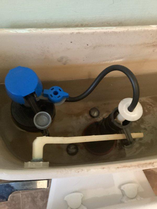 Responded to report of toilet continuously running due to water leaking from tank into bowl. Inspected toilet tank and identified failed flush valve seal causing constant water flow. Replaced deteriorated rubber flapper and flush seal assembly on existing flush valve mechanism. Tested flush operation multiple times to verify proper seal and confirm leak was eliminated. Toilet now holding water in tank properly with no further leakage into bowl.