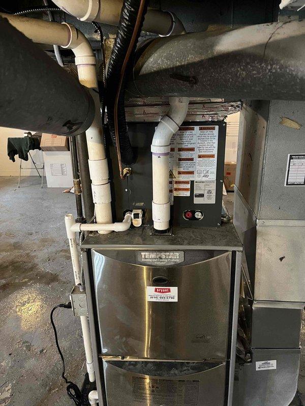 Successfully completed installation of add-on air conditioning system to existing heating infrastructure. Installed and integrated new AC components with existing Temp-Star furnace unit, including proper refrigerant line connections, condensate drainage system using PVC piping, and electrical connections. Configured ductwork integration to ensure proper airflow distribution throughout the system. All venting, piping, and duct connections secured and tested for proper operation. System commissioned and verified operational parameters within manufacturer specifications.