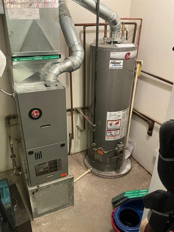 Completed estimate for central air conditioning installation on 900 square foot residential property with existing 2014 furnace. Inspected basement mechanical room, photographed existing HVAC equipment including furnace with supply ductwork, water heater, and electrical panel to assess system compatibility and installation requirements. Evaluated electrical service capacity for new AC condenser and air handler integration with current forced air heating system.