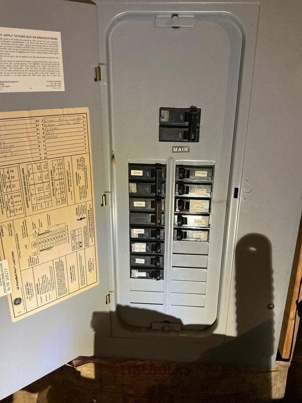 Completed estimate for central air conditioning installation on 900 square foot residential property with existing 2014 furnace. Inspected basement mechanical room, photographed existing HVAC equipment including furnace with supply ductwork, water heater, and electrical panel to assess system compatibility and installation requirements. Evaluated electrical service capacity for new AC condenser and air handler integration with current forced air heating system.