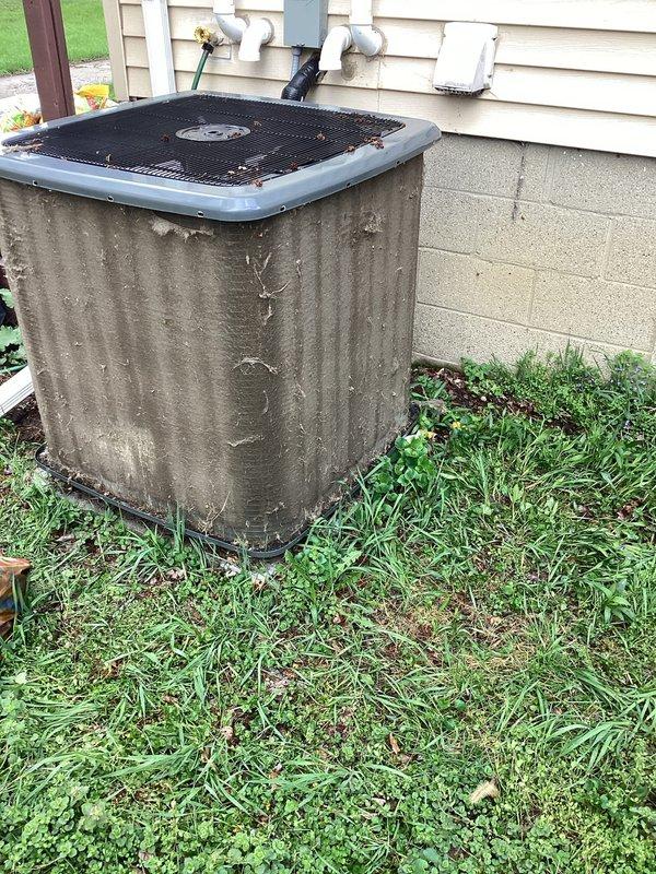 Responded to no cooling complaint where system was blowing warm air. Upon arrival, performed diagnostic evaluation of outdoor condenser unit and indoor air handler. Inspected both units for proper operation, checked refrigerant levels, and tested electrical components. Documented equipment condition with photos showing outdoor condenser unit with weathered exterior surfaces and debris accumulation on top grille. Verified system operation and identified root cause of cooling failure. Completed necessary repairs to restore proper cooling function and confirmed adequate airflow throughout system.