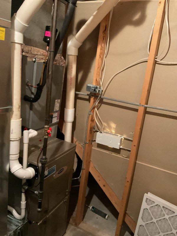 Completed annual heating maintenance on 2020 Carrier furnace model WT 10-2030 with humidifier system. Performed comprehensive tune-up including inspection of heat exchanger, burner assembly, and gas connections; verified proper operation of blower motor and tested all safety controls. Inspected PVC intake and exhaust venting system for proper termination and secure connections; checked condensate drain lines and verified trap functionality. Replaced air filter, evaluated humidifier operation, and confirmed all ductwork connections were secure throughout the basement installation. System operating within manufacturer specifications with no immediate concerns noted.