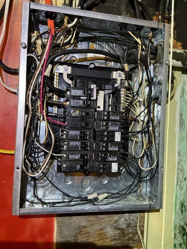 Conducted electrical estimate for underground service line replacement between garage and main dwelling. Inspected existing electrical panel and wiring configuration in utility closet, documenting current circuit breaker arrangement and wire routing from panel to overhead junction points. Assessed condition of interior panel connections and identified wire pathways that connect to exterior underground feed. Evaluated scope of work required to excavate and replace deteriorated underground electrical line, including panel modifications and connection points at both structures. Provided comprehensive documentation through photographs of existing electrical infrastructure to support estimate for trenching, conduit installation, and new wire installation between buildings.