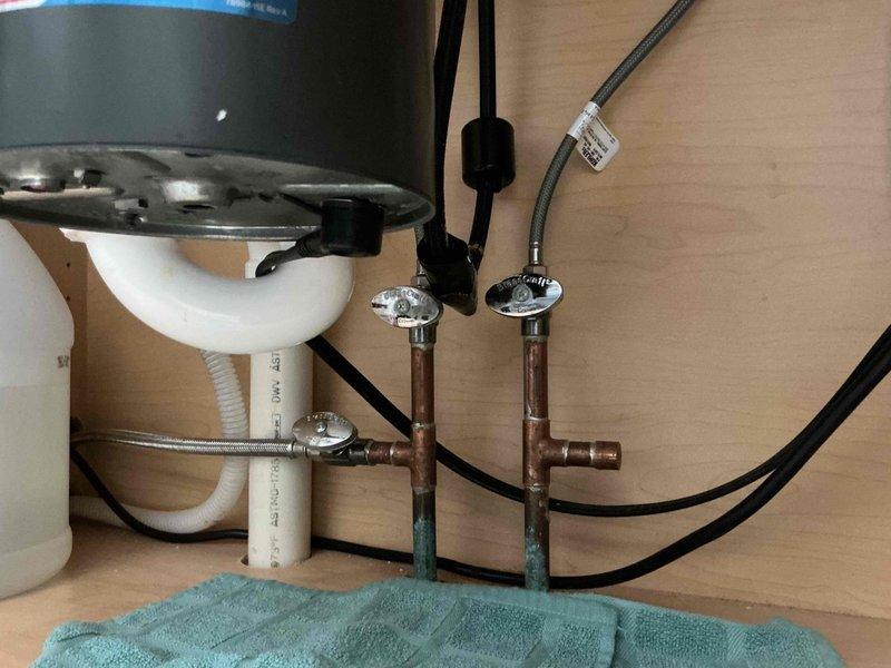 Responded to service call for Kohler Sink Model K596 with reported check valve leak that was progressively worsening. Inspected sink assembly and attempted valve removal without success due to access limitations or corrosion. Additionally evaluated toilet tank valve mechanism, noting mineral deposits and potential component wear requiring attention. Inspected basement water supply line feeding exterior hose spigot and identified crack in copper piping that requires repair to prevent water damage. Documented all findings with photographs for customer reference and future repair planning.