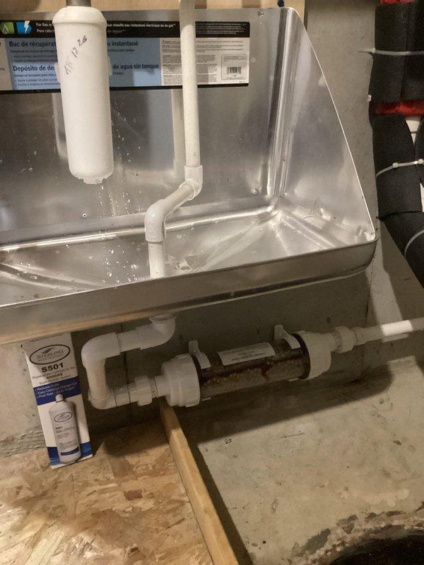 Performed comprehensive annual tune-up and flush service on a 4-year-old Navien tankless water heater. Removed and cleaned inlet filter, which contained significant sediment accumulation and discolored debris, then performed complete system flush to remove scale buildup and restore optimal flow rates. Inspected condensate collection pan and drainage system, verified proper operation of all components, and confirmed unit returned to manufacturer specifications.