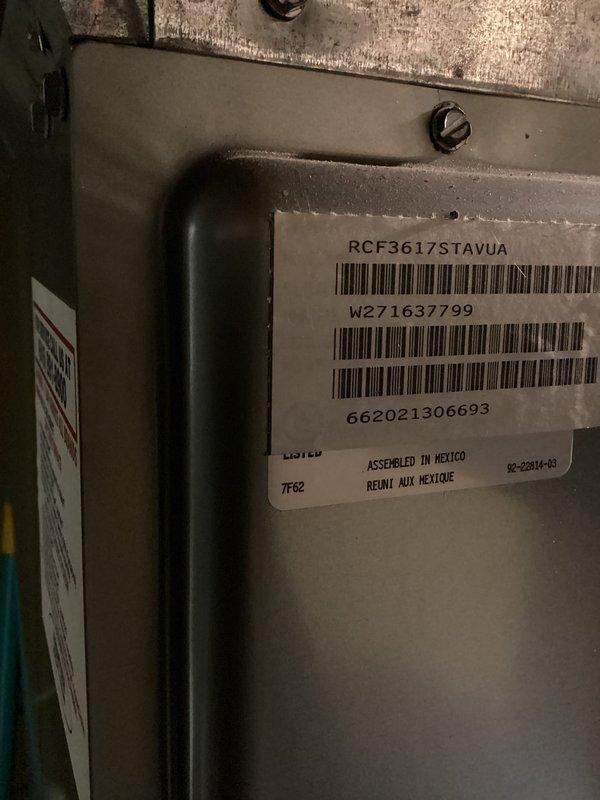 # No Heat Service Call

Responded to a no heat call for a furnace that was not turning on. Upon arrival, inspected a Goodman furnace model RCF361Z7STAVUA, serial number W271G37799, manufactured in 2012 (approximately 10 years old). Unit is installed in basement mechanical room alongside water heater. Documented equipment identification and installation condition with photos for service records. Furnace cabinet and surrounding area showed normal wear for age with dust accumulation at base typical of basement installation.