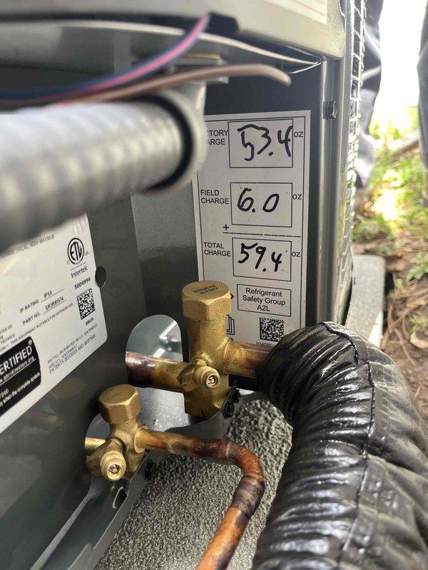 Completed full HVAC system replacement including installation of new Gibson air handler unit in basement utility room with associated ductwork connections and refrigerant line integration. Installed outdoor condensing unit with proper refrigerant charging per manufacturer specifications, documenting factory charge of 52.4 oz, field charge of 6.0 oz, for total system charge of 59.4 oz of A2L refrigerant. System commissioned, tested, and left in operational condition with all electrical connections, ductwork, and controls verified functional.