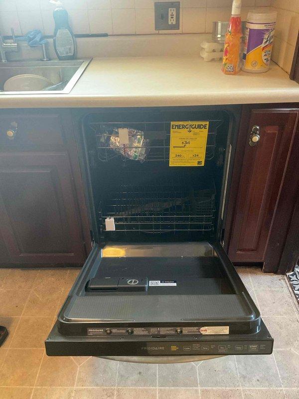 Installed new stainless steel dishwasher in residential kitchen, connecting water supply line and ensuring proper drainage hookup. Unit was tested for leaks and proper operation, with all connections verified secure and functional.
