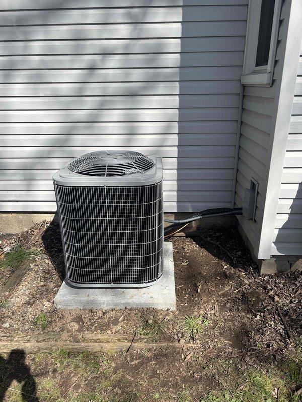 Completed full air conditioning system installation including outdoor condenser unit mounted on concrete pad and connected to existing Carrier furnace with integrated ductwork in basement. Installed all necessary refrigerant lines, electrical connections, and condensate drainage, with system tested and verified operational. Michigan Saves financing documentation processed through DocuSign for customer approval.