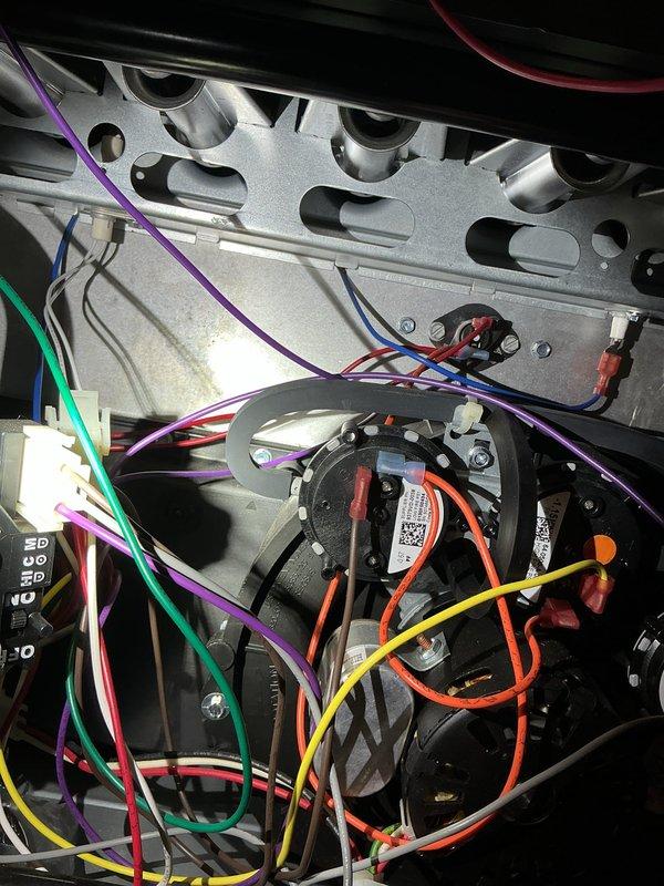 Responded to heating system complaint and performed diagnostic inspection of heat pump furnace unit. Upon arrival, accessed crawlspace area to inspect ductwork and system infrastructure, verifying proper installation of supply lines and structural support systems. Proceeded to main unit inspection, removing access panels to examine internal components including heat exchanger assembly, blower motor, and electrical control systems.

Conducted thorough visual inspection of heat exchanger tubes, verifying no cracks or signs of failure in the metallic cylindrical ports. Examined blower motor assembly for proper operation and secure mounting. Inspected all electrical connections, including multi-conductor wiring harnesses connecting control board, safety switches, and operational components. Verified wire routing was secure and properly organized throughout unit housing. Checked control board for any error codes or indicator lights suggesting system faults.

Photographically documented exis