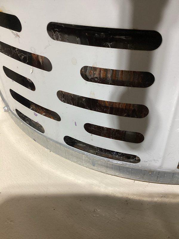 Responded to service call for Bradford White water heater model M150S6FN with reports of potential leak and no hot water production. Upon inspection, discovered significant rust and corrosion visible through the ventilation grille at the base of the unit, indicating internal deterioration and compromised structural integrity. The oxidation patterns and discoloration suggest prolonged moisture exposure and potential tank failure. Documented the unit's condition including manufacturer specifications showing 40,000 BTU/hr natural gas input rating. Verified all safety labels and operational warnings were intact and legible. Photographed evidence of corrosion for service records and provided assessment of unit condition to determine necessary repairs or replacement recommendations.