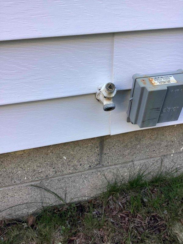 Replaced outdoor spigot at exterior wall of residence. Removed existing frost-free hose bib and installed new quarter-turn ball valve spigot with proper mounting to ensure secure attachment to structure and prevent future leaks.