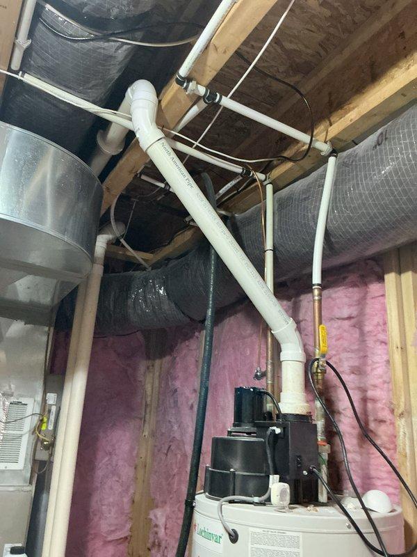 Responded to no hot water complaint on 13-year-old residential water heater. Upon inspection, diagnosed failed heating element in electric water heater located in utility room with associated plumbing components including pressure tank and filtration system. Replaced defective heating element, verified proper electrical connections, tested thermostat operation, and restored full hot water functionality to unit.