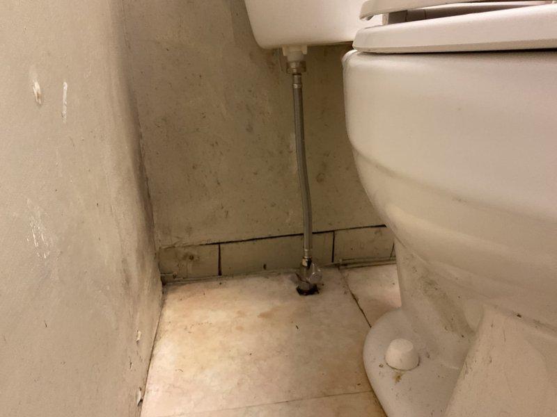 Responded to callback for toilet leak at base in 104-year-old residence. Upon inspection, identified water seepage at toilet base connection related to previous service work. Removed toilet, inspected and replaced wax ring seal, verified flange condition, and reinstalled toilet with proper alignment and secure mounting. Tested flush cycles and confirmed no further leakage at base connection. Documented conditions with photographs for service records.
