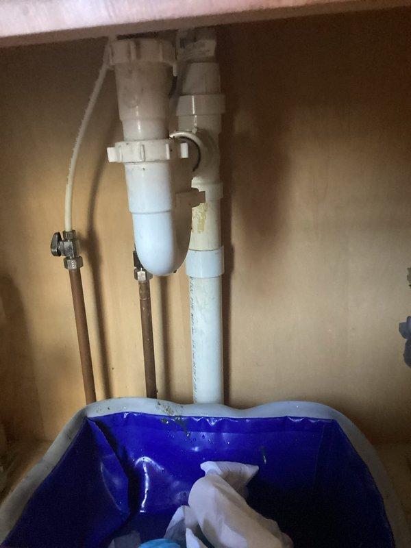 Responded to emergency call for valuable ring dropped down bathroom sink drain. Disassembled P-trap assembly beneath vanity sink to retrieve item and restore drainage function. Successfully recovered ring from trap and reassembled plumbing connections. Tested water flow to confirm proper drainage and verified no leaks at slip joint connections before returning fixture to service.
