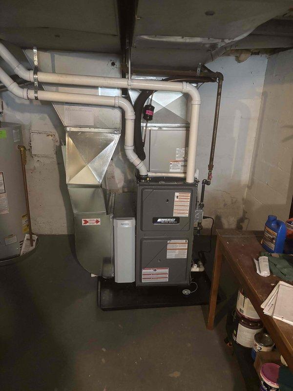 Completed full furnace installation in basement mechanical room, replacing existing unit with new high-efficiency system. Connected all ductwork, electrical wiring, and PVC venting to manufacturer specifications, ensuring proper airflow and system integration with existing HVAC infrastructure. Tested unit operation, verified all safety controls, and confirmed system functionality before completing installation.