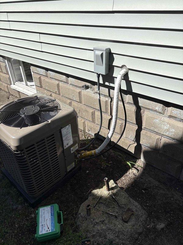 # CP-Cooling Problem Resolution

Responded to service call for 7-year-old York air conditioning system experiencing inadequate cooling performance. Unit was operational and producing airflow but failing to effectively cool the residence.

Upon arrival, conducted comprehensive system evaluation including both indoor and outdoor components. Inspected basement-mounted air handler and associated ductwork for proper airflow and operational integrity. Verified all electrical connections and mounting hardware at indoor unit location.

Proceeded to outdoor condenser unit for detailed assessment. Performed visual inspection of refrigerant line set, noting proper insulation and secure mounting to building exterior. Checked electrical disconnect box and verified power supply to condensing unit. Examined condenser coil condition, cabinet integrity, and overall unit operation.

Conducted refrigerant system diagnostics including pressure testing and temperature differential measurements across the e