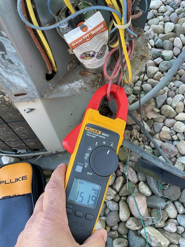 # No Cool Service Call

Responded to service call for 20-year-old central air conditioning system not cooling while heating function remained operational. Upon arrival, performed diagnostic testing on outdoor condensing unit using Fluke 902FC clamp meter to measure electrical current and verify compressor operation. Readings indicated abnormal amperage draw, suggesting potential compressor or electrical component failure.

Inspected indoor Bryant furnace and air handler system in basement utility area to verify proper thermostat communication and indoor blower operation. Confirmed heating mode functioning correctly, isolating issue to outdoor cooling components. Evaluated electrical connections at outdoor unit junction box, checking multiple wire connections and voltage supply to compressor and condenser fan motor.

Given the age of the equipment at 20 years and diagnostic findings indicating major component failure, discussed system condition and repair versus replacement options. Doc