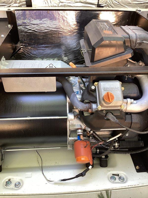 Completed annual preventative maintenance on Generac standby generator installed in 2019. Performed comprehensive tune-up including oil and filter change as evidenced by oil drain valve access, inspected fuel system components and gas regulator assembly, verified proper operation of all safety controls, cleaned battery terminals and tested battery voltage, checked coolant level and condition, inspected air filter, tested automatic transfer switch functionality, and ran unit through full exercise cycle to confirm proper operation under load. All components found to be functioning within manufacturer specifications with no deficiencies noted. Customer provided detailed explanation of annual maintenance procedures performed to ensure understanding of preventative service value.