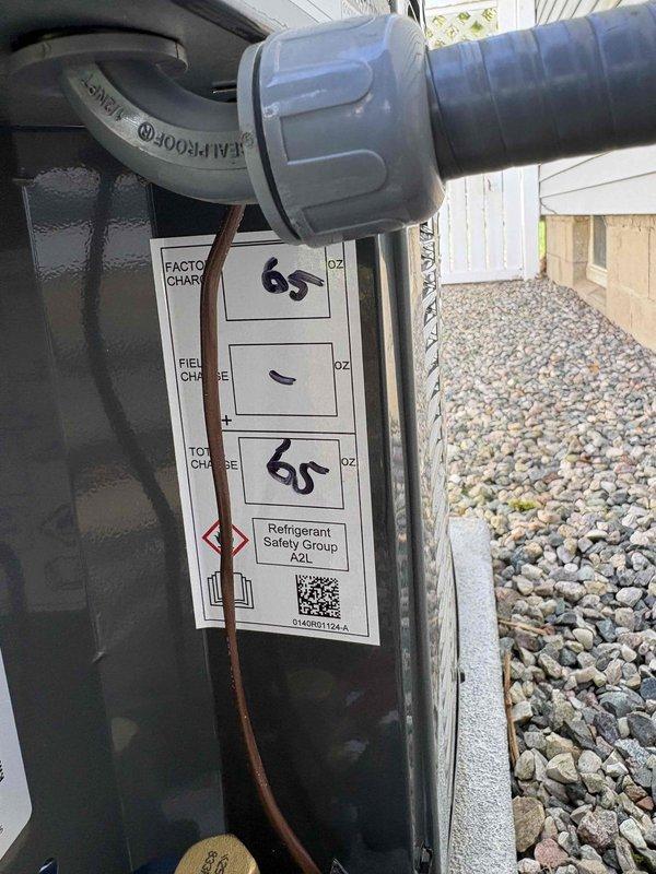 Successfully completed a full HVAC system upgrade consisting of a new furnace installation and air conditioning system addition in a residential basement mechanical room. The furnace was installed with proper metallic ductwork connections extending to the ceiling distribution system, while the outdoor condensing unit was positioned alongside the house exterior with appropriate refrigerant line routing and gravel pad placement. All equipment was properly labeled with refrigerant safety classifications (A2L), field charge documentation was completed and affixed to the outdoor unit, and the system was integrated with existing infrastructure including water heater proximity considerations and wall-mounted air quality equipment coordination.