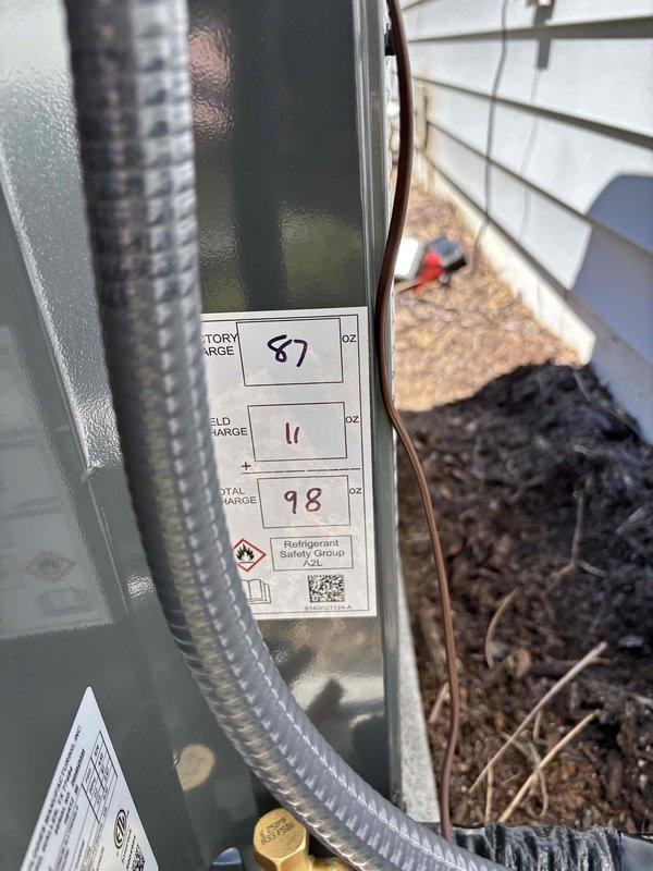 Completed full HVAC system installation including outdoor condensing unit and indoor air handler with York furnace integration. Installed refrigerant lines with proper insulation, electrical connections via flexible metal conduit, and PVC vent piping for exhaust and intake. System charged with refrigerant to manufacturer specifications, tested all controls and thermostats, verified proper airflow through ductwork connections, and confirmed operational parameters within acceptable range.