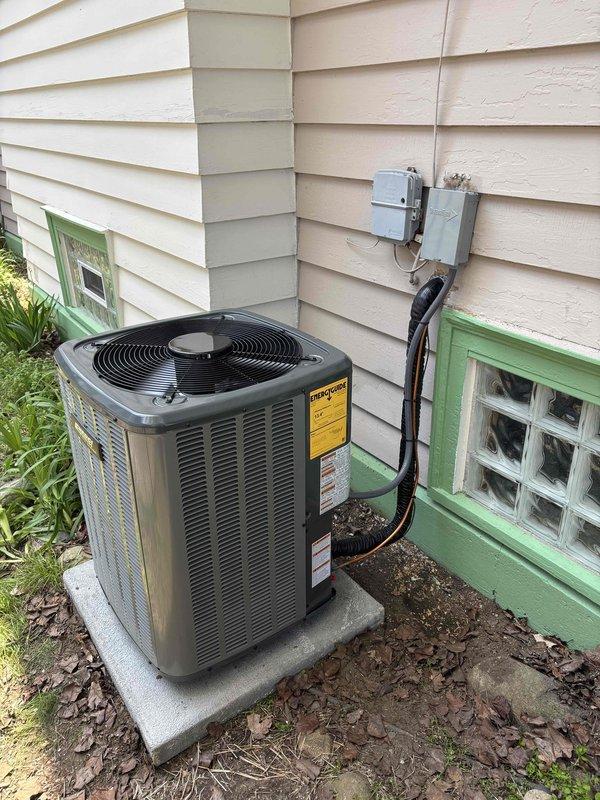 Completed full HVAC system replacement including new furnace and air conditioning unit. Installed outdoor condensing unit on existing concrete pad at exterior corner of residence with proper electrical disconnect and conduit routing. Mounted new furnace in basement mechanical room with associated air handler, connected PVC condensate drainage, and integrated all ductwork connections to existing system.