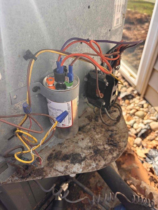 Responded to a no-cooling call on a 9-year-old Rheem system that was cycling off after 10-15 minutes of operation and requiring manual resets to restart. Upon inspection, diagnosed a failed dual-run capacitor causing the compressor to short-cycle and shut down on thermal overload. Replaced the defective capacitor with proper OEM-spec replacement, verified all electrical connections, and tested system operation through multiple complete cycles. Unit now running continuously with proper amp draw and cooling performance restored. System returned to full operational status.