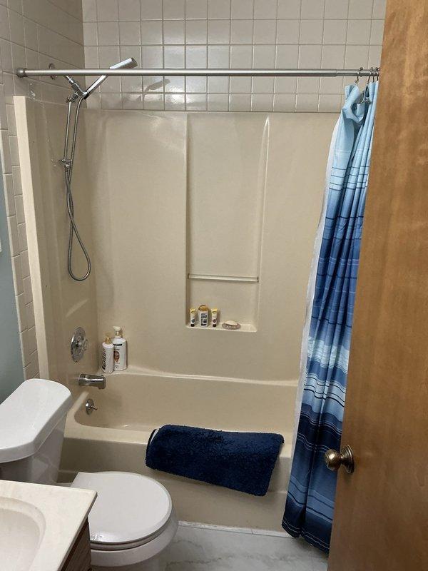 Responded to service call for sticking tub/shower faucet control valve that had become increasingly difficult to operate in 1989-built home. Inspected chrome shower fixture assembly and determined the single-handle diverter valve cartridge required replacement due to mineral buildup and wear causing restricted movement. Removed existing valve trim, extracted worn cartridge, cleaned valve body, and installed new replacement cartridge compatible with existing fixture. Tested operation of both tub spout and showerhead functions to verify proper water flow and smooth handle operation throughout full range of motion. System restored to normal functionality with no leaks detected.