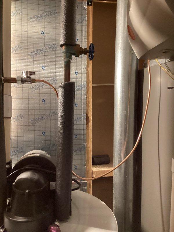 Responded to heating system evaluation for water intrusion concerns. Upon inspection, discovered water stains in condensate drain pan with rust accumulation forming near the condensation drain line on 19-year-old Lennox furnace. Documented existing conditions with photographs showing mechanical room plumbing components, insulated piping, and HVAC equipment layout. Performed comprehensive AC tune-up service in conjunction with furnace evaluation. Assessed drain line functionality and condensate removal system operation. System currently under extended warranty coverage through February 2032. Recommended monitoring condensate drainage and addressing rust buildup to prevent future blockages or overflow conditions.