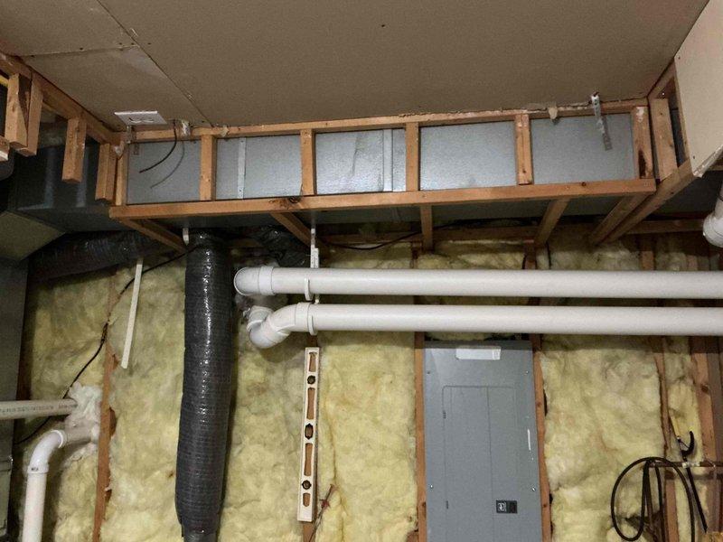 Responded to service call for on-demand tankless water heater experiencing intermittent failure to ignite at specific fixtures while operating normally at others. Performed diagnostic inspection of wall-mounted tankless unit, removing front access panel to examine internal components including heat exchanger, control board, wiring connections, and gas supply lines. Verified proper electrical connections, inspected circuit board for signs of failure, and checked all wire harnesses for loose connections or corrosion. Examined copper piping and gas line connections for restrictions or issues affecting flow sensing. Tested unit operation at multiple fixtures throughout the property to replicate reported intermittent ignition problem. Documented findings with photographs of internal components and installation environment for reference. Homeowner noted unit age unknown, having been in place at least five years prior to current ownership, which may contribute to component wear affecting flow