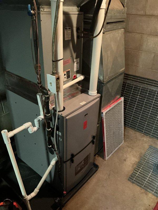 Completed annual cooling system maintenance on residential air conditioning unit over 10 years old. Performed comprehensive system inspection including refrigerant level check, electrical component testing, and condenser coil cleaning. Verified proper thermostat operation and airflow throughout the system. Inspected furnace and air handler assembly in basement mechanical room, confirming all connections secure and drain lines clear. Replaced air filter with new pleated media filter to ensure optimal airflow and indoor air quality. Tested system startup and shutdown sequences, confirmed adequate cooling capacity and proper cycling. All safety controls functioning within manufacturer specifications. System operating efficiently with no immediate service needs identified.