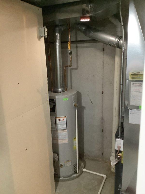 Completed annual ASTU-AC Super Tune-up on 27-year-old Bryant HVAC system. Performed comprehensive inspection of furnace and air handler components, verified proper operation of all safety controls, checked electrical connections, and tested system performance. Observed condensate drain pan showing mineral deposits and biological growth accumulation; cleaned drain line and pan, ensured proper drainage function. Inspected ductwork routing, water heater connections, and gas line installations in mechanical room. All equipment operating within normal parameters following maintenance completion.