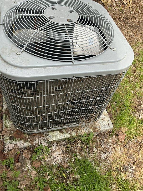 Completed annual cooling maintenance and tune-up on outdoor air conditioning condenser unit. Upon arrival, found unit operational but with accumulated debris on condenser coils and biological growth on concrete pad. Performed comprehensive system inspection including electrical connections, refrigerant pressures, and amperage draws. Cleaned condenser coils to remove dirt, leaves, and outdoor debris that had reduced airflow efficiency. Verified proper fan motor operation and lubricated as needed. Checked refrigerant charge and confirmed system pressures within manufacturer specifications. Inspected and tightened all electrical connections. Tested capacitor performance and found within acceptable range. Verified proper drainage and cleared area around unit of excessive vegetation and debris. System tested successfully with proper cooling operation confirmed. Unit left in good working condition with improved airflow through cleaned coils, ensuring optimal performance for the cooling seaso