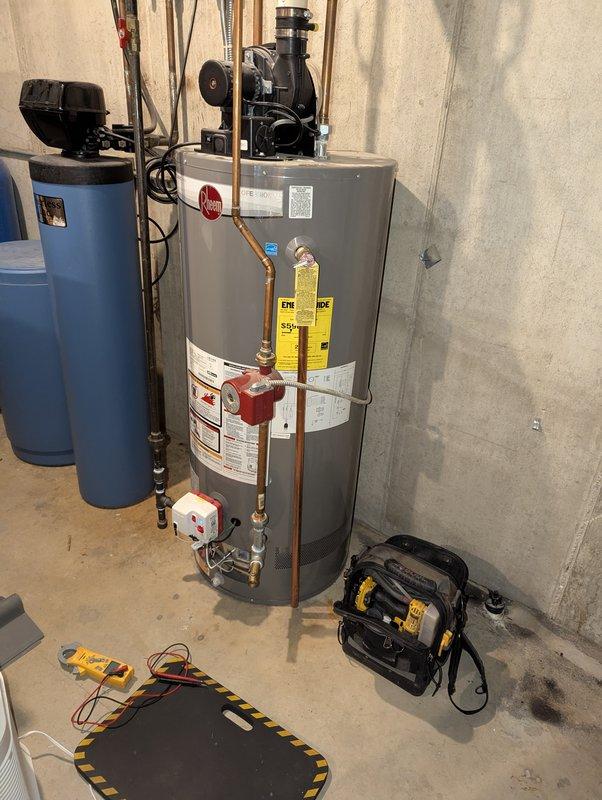 Responded to service call for 9-year-old Rheem water heater (Model PRO40S2 RH63 PV, 40 gallon) not heating following recent repair. Unit displayed diagnostic fault code of 7 blinks with 3-second pause, repeating pattern, indicating gas control valve failure or gas supply issue. Performed comprehensive diagnostic testing of gas valve assembly, electrical connections, and control board. Verified proper gas supply pressure at red gas valve and copper supply line connections. Tested thermal cutoff switch and thermocouple operation. Inspected combustion chamber and flue venting system for proper operation. Noted customer had recently relocated items near water heater including air purifier, which may have affected airflow. Cleared fault code and restored unit to proper heating operation. Verified ignition sequence and flame sensor response. Unit tested successfully with proper temperature rise and no recurring fault codes.