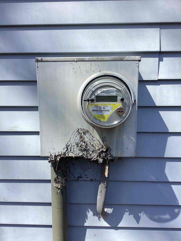 Conducted on-site evaluation for Generac generator installation at a 50-year-old residential property. Performed comprehensive assessment of existing electrical infrastructure, including inspection of main electrical panel located in attic space and exterior meter base mounted on building exterior. Documented current electrical service configuration, wiring pathways through ceiling joists, and available connection points for generator integration. Identified active wasp nest at exterior meter location requiring remediation prior to installation work. Photographed electrical panel specifications, meter enclosure condition, and structural considerations for generator placement and transfer switch installation. Provided detailed estimate for complete standby generator system including equipment, transfer switch, necessary electrical upgrades, and professional installation services.