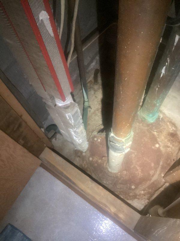 Responded to service call for sump pump running continuously. Upon arrival, performed comprehensive inspection of sump pump system and surrounding drainage components. Examined pump operation, float switch mechanism, and discharge piping. Inspected floor drain and surrounding plumbing infrastructure in basement utility area. Verified proper drainage flow and checked for obstructions or mechanical failures that could cause constant pump cycling. Documented existing conditions with photos showing exposed plumbing, copper supply lines with insulation, HVAC ductwork, floor drain opening with visible sediment accumulation, and PVC drainage components. Assessed overall system functionality to determine cause of continuous operation concern.