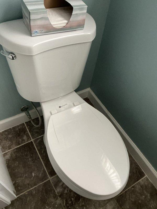 Responded to service call for toilet evaluation and replacement estimate. Upon arrival, conducted thorough inspection of existing toilet fixture in bathroom. Documented current condition of white porcelain toilet with standard tank and flush mechanism. Assessed installation area, noting corner placement, existing water supply line connection, and tile flooring configuration. Photographed toilet and exterior building access point for estimate documentation. Provided client with assessment findings and replacement options for one to two toilet fixtures as requested.