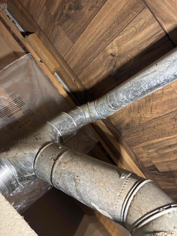 Responded to no heat call on Lennox furnace system. Upon inspection, accessed unit in basement mechanical room and documented existing equipment configuration including ductwork routing through attic space. Evaluated furnace with front panel removed, inspecting blower motor assembly, electrical connections, and internal components for proper operation. Restored heating function and verified system operational status before departure.