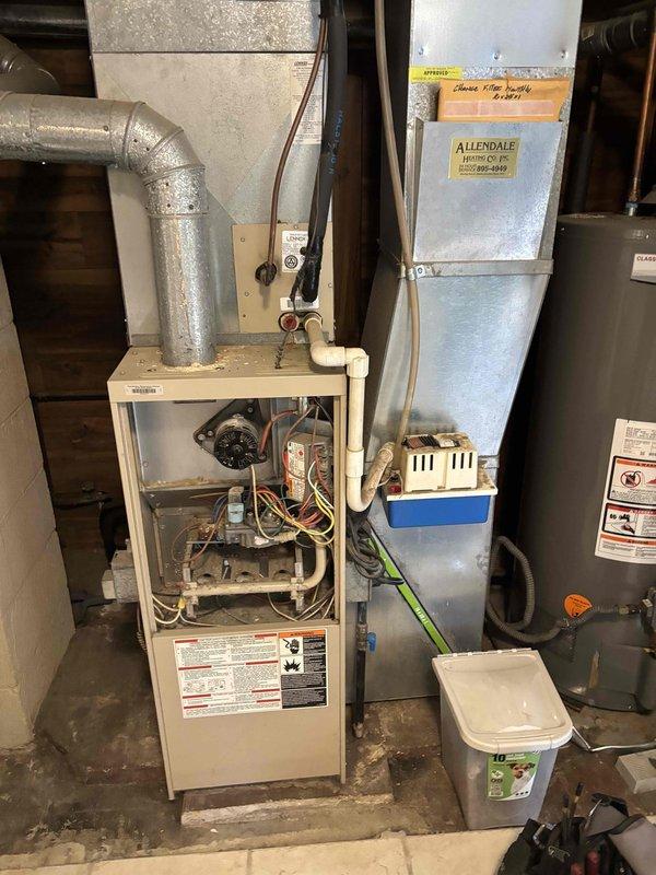 Responded to no heat call on Lennox furnace system. Upon inspection, accessed unit in basement mechanical room and documented existing equipment configuration including ductwork routing through attic space. Evaluated furnace with front panel removed, inspecting blower motor assembly, electrical connections, and internal components for proper operation. Restored heating function and verified system operational status before departure.