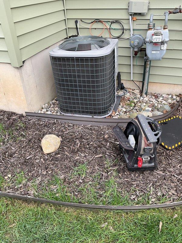 Responded to service call for outdoor air conditioning unit with breaker tripping issue and suspected seized compressor. Performed diagnostic inspection of condenser unit and electrical components, documenting equipment condition and installation configuration. Assessed system age, brand identification, and overall operational status to provide comprehensive evaluation for repair versus replacement options as requested for second opinion comparison.