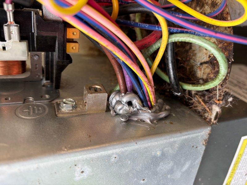 Responded to no power condition on 4-year-old EnergiAir system where customer had already replaced thermostat without resolution. Upon inspection, found extensive dirt and debris accumulation in control board area and wiring connections, along with significant rust and corrosion on mounting hardware near copper line set. Identified compromised low-voltage wiring connections due to environmental contamination affecting thermostat circuit continuity. Cleaned all wire terminals and junction points, removed debris from control board mounting area, verified proper voltage at transformer output, and restored power to thermostat and system. Tested all system functions and confirmed proper operation of heating and cooling cycles.