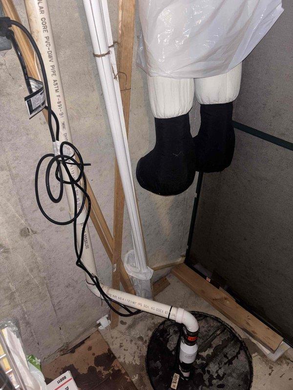 Responded to emergency call for sump pump actively discharging water onto basement floor. Upon arrival, inspected existing sump pump system and basin for operational failures. Verified pump cycling and discharge line integrity, secured PVC discharge piping with proper strapping to wall framing, and confirmed proper drainage away from foundation. Cleaned sump pit of debris and sediment buildup, tested pump float switch operation, and ensured all connections were watertight to prevent future water intrusion onto floor.