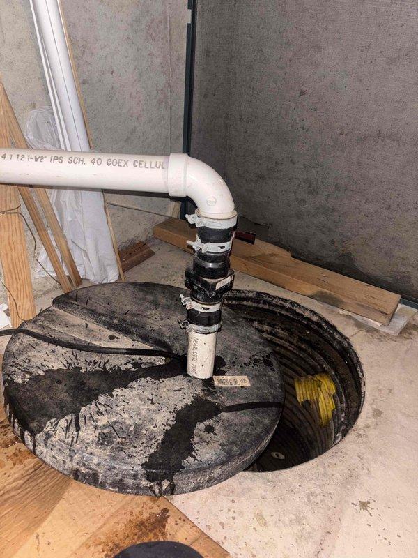 Responded to emergency call for sump pump actively discharging water onto basement floor. Upon arrival, inspected existing sump pump system and basin for operational failures. Verified pump cycling and discharge line integrity, secured PVC discharge piping with proper strapping to wall framing, and confirmed proper drainage away from foundation. Cleaned sump pit of debris and sediment buildup, tested pump float switch operation, and ensured all connections were watertight to prevent future water intrusion onto floor.