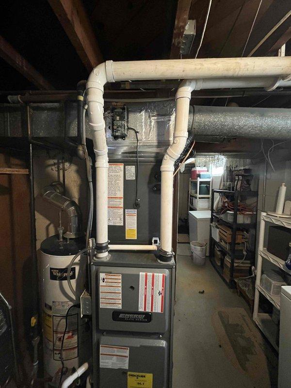 Completed full air conditioning system replacement at residential property. Installed new Lennox AC condenser unit on exterior concrete pad with proper refrigerant line connections and electrical hookup to existing furnace system in basement. System tested and verified operational with all connections secured and equipment running within manufacturer specifications.