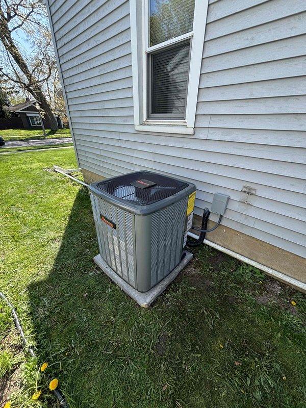 Completed full air conditioning system replacement at residential property. Installed new Lennox AC condenser unit on exterior concrete pad with proper refrigerant line connections and electrical hookup to existing furnace system in basement. System tested and verified operational with all connections secured and equipment running within manufacturer specifications.