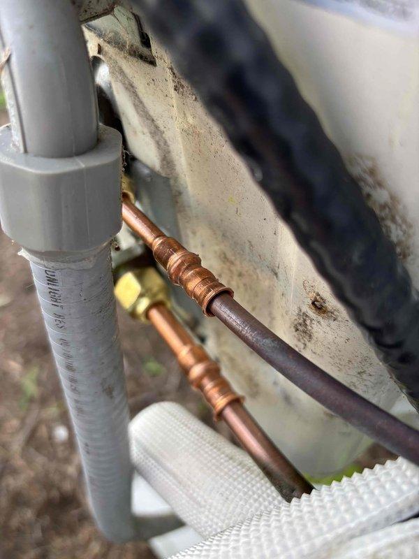 Replaced four flare fittings on refrigerant lines, evacuated the system to remove moisture and contaminants, and recharged with proper refrigerant to manufacturer specifications. System tested and verified operational with no leaks detected.