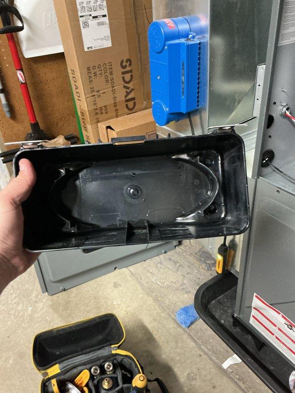 Completed annual cooling maintenance on EnergiAir system (WT 01-2035, CM: 2022). Inspected and cleaned condensate drain pan which contained standing water with visible sediment and mineral deposits. Serviced condensate management system including drain line and pump components to ensure proper drainage function.