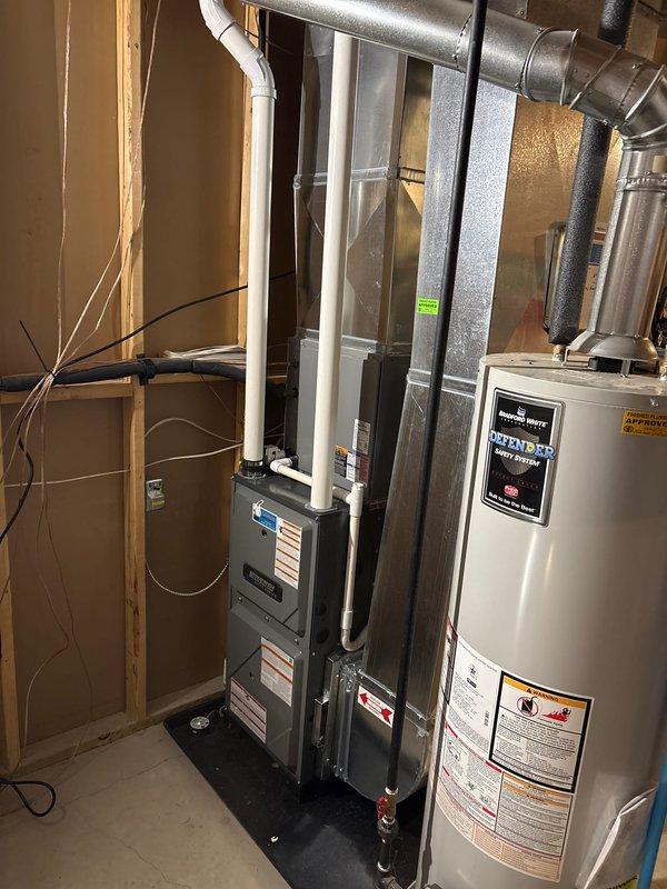 Completed full furnace installation in basement utility room. Installed high-efficiency furnace unit with PVC exhaust venting system, ensuring proper connection to existing ductwork and utility lines. System tested and operational, with all manufacturer specifications met and safety protocols verified.