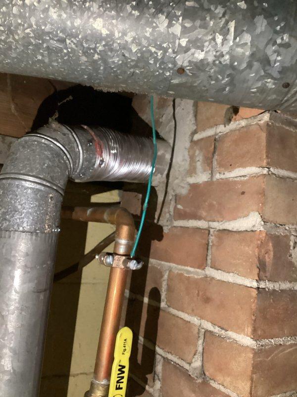 Responded to service call for water heater with pilot light that would not ignite. Upon arrival, inspected approximately 10-year-old unit and verified pilot assembly would not light. Customer reported gas valve had been replaced within the past year and suspected current issue was related to that component. Performed diagnostic testing of gas valve operation, thermocouple function, and pilot assembly. Checked gas supply pressure and verified adequate flow to unit. Inspected burner assembly and pilot orifice for debris or blockage. Documented existing conditions with photographs showing unit installation and surrounding plumbing connections. Based on preliminary assessment and recent history of gas valve replacement, determined further evaluation needed to identify root cause of pilot ignition failure.